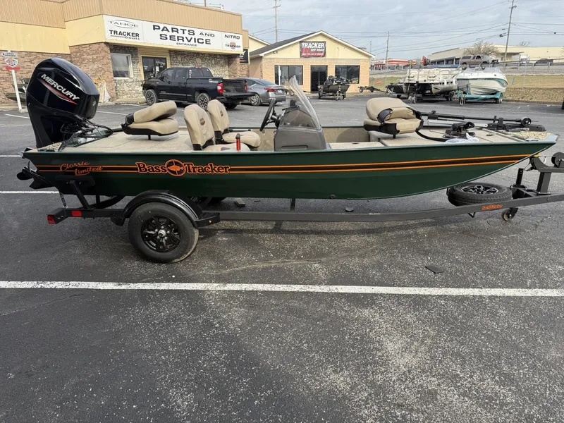 Slide: The Image of 2025 Tracker Bass Tracker Classic Limited boat on trailer in parking lot. - 2