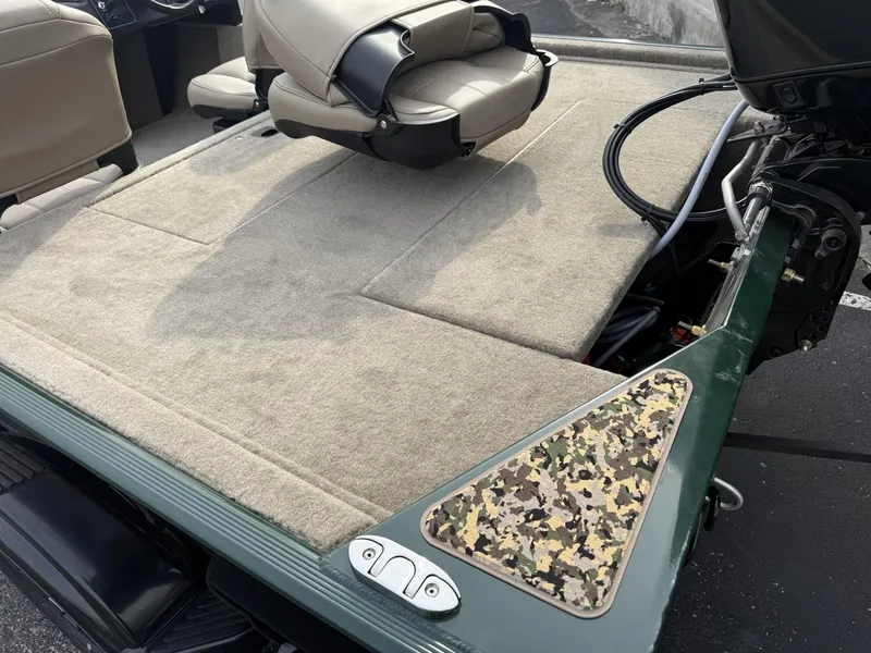 Slide: The Image of 2025 Tracker Bass Tracker Classic Limited boat interior with beige seats and camouflage detail. - 3