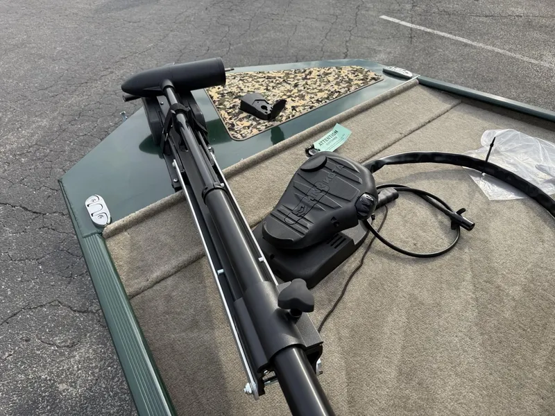 Slide: The Image of 2025 Tracker Bass Tracker Classic Limited boat with trolling motor on deck. - 8