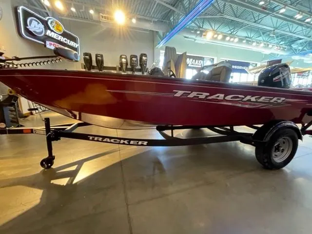 Slide: The Image of 2025 Tracker Super Guide V-16 SC boat on display in showroom. - 3