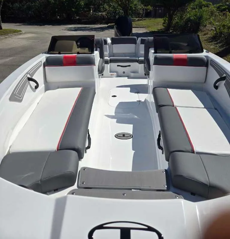 Slide: The Image of 2025 Tahoe T21 boat interior with gray and red seating, spacious layout, and modern design. - 8
