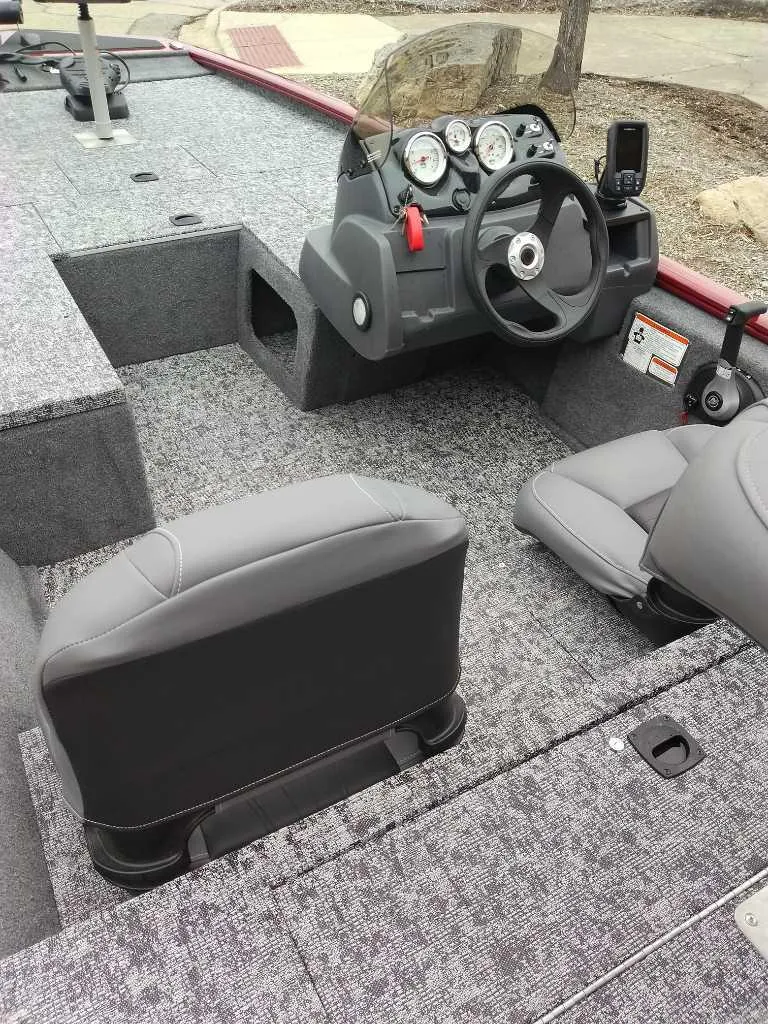 Slide: The Image of 2025 Tracker Pro 170 boat interior with steering console and seating. - 3
