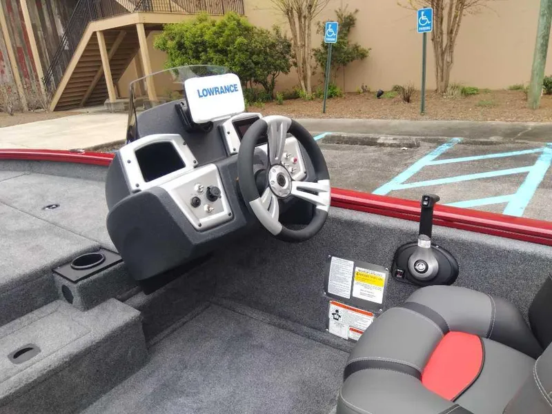 Slide: The Image of 2025 Tracker Pro Team 190 boat interior with steering wheel and Lowrance display. - 12