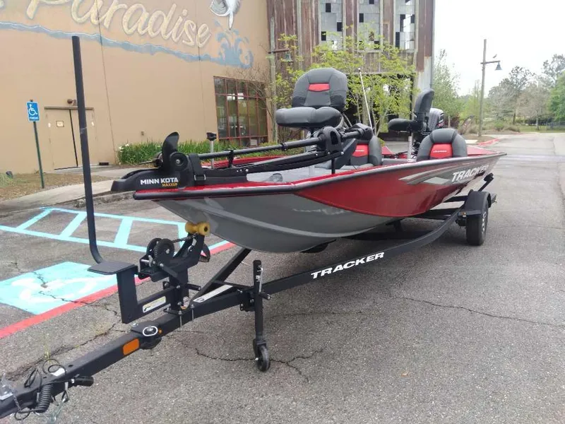 Slide: The Image of 2025 Tracker Pro Team 190 boat on trailer in parking lot. - 14