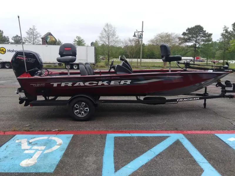 Slide: The Image of 2025 Tracker Pro Team 190 boat on trailer in parking lot. - 4