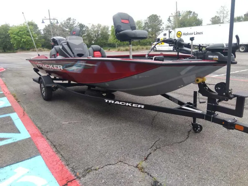 Slide: The Image of 2025 Tracker Pro Team 190 boat on trailer in parking lot. - 5