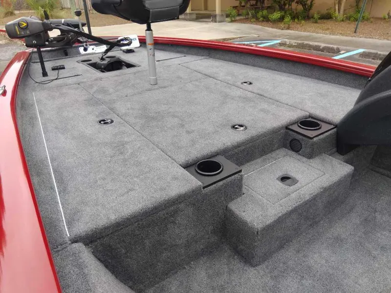 Slide: The Image of 2025 Tracker Pro Team 190 boat deck with gray carpet and red trim. - 9