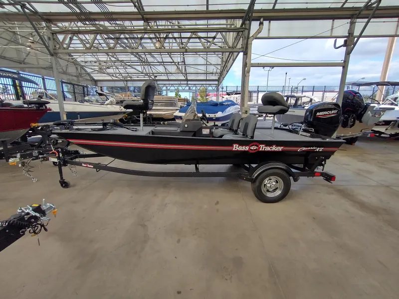 The Image of 2025 Tracker Bass Tracker Classic XL boat on trailer, parked outdoors. - 0