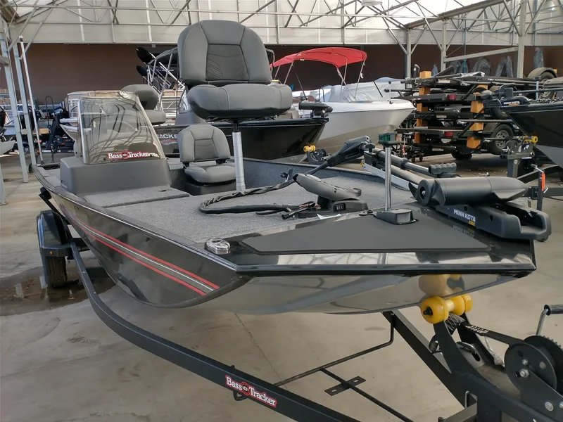 Slide: The Image of 2025 Tracker Bass Tracker Classic XL boat on trailer, parked outdoors. - 19