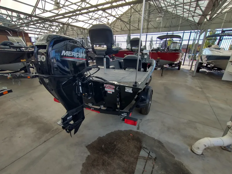 Slide: The Image of 2025 Tracker Bass Tracker Classic XL boat interior with steering wheel and seating. - 3