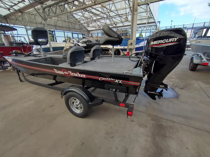 Slide: The Image of 2025 Tracker Bass Tracker Classic XL boat on trailer in showroom. - 5