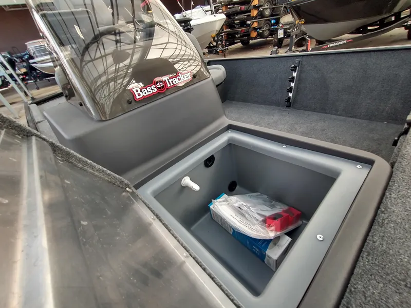 Slide: The Image of 2025 Tracker Bass Tracker Classic XL boat interior with steering wheel and Lowrance equipment. - 9