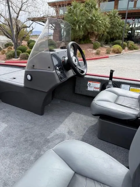 Slide: The Image of 2025 Tracker Bass Tracker Classic XL interior with steering wheel and seating. - 8