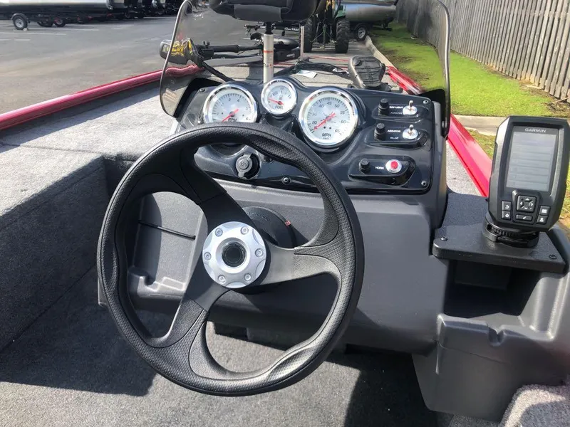 Slide: The Image of 2025 Tracker Pro 170 boat dashboard with steering wheel and gauges. - 10