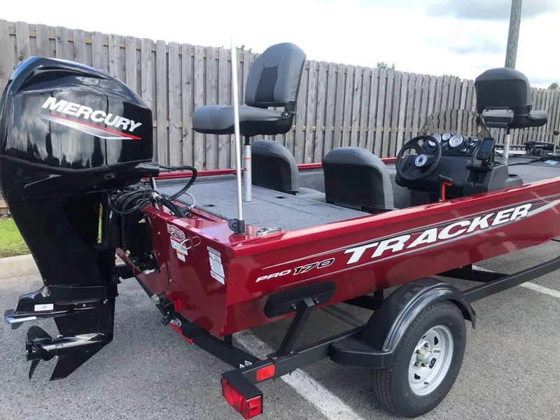 Slide: The Image of 2025 Tracker Pro 170 boat with Mercury engine, parked on trailer. - 13