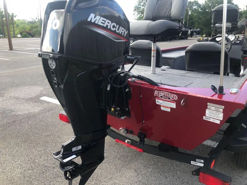 Slide: The Image of 2025 Tracker Pro 170 boat with Mercury outboard motor in parking lot. - 3