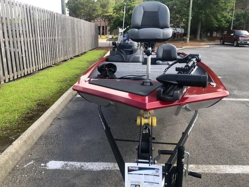 Slide: The Image of 2025 Tracker Pro 170 boat parked in a lot, featuring a sleek red design. - 4