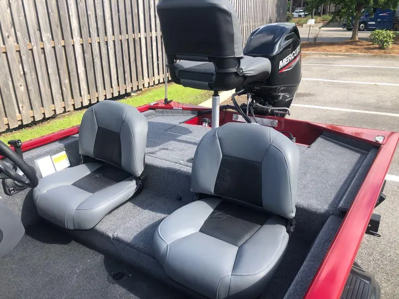 Slide: The Image of 2025 Tracker Pro 170 boat interior with gray seating and Mercury outboard motor. - 9