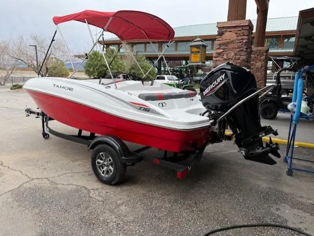 Slide: The Image of 2025 Tahoe T16 boat with red hull and Mercury outboard motor. - 2
