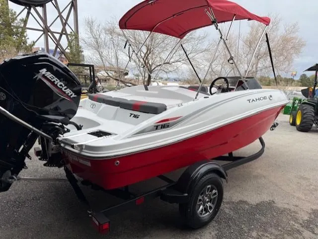 Slide: The Image of 2025 Tahoe T16 boat with red canopy and Mercury engine on trailer. - 3
