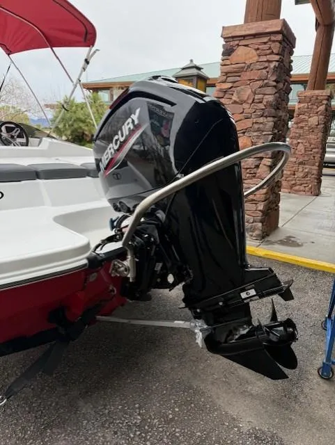 Slide: The Image of 2025 Tahoe T16 boat with Mercury outboard motor, docked near stone pillars. - 4