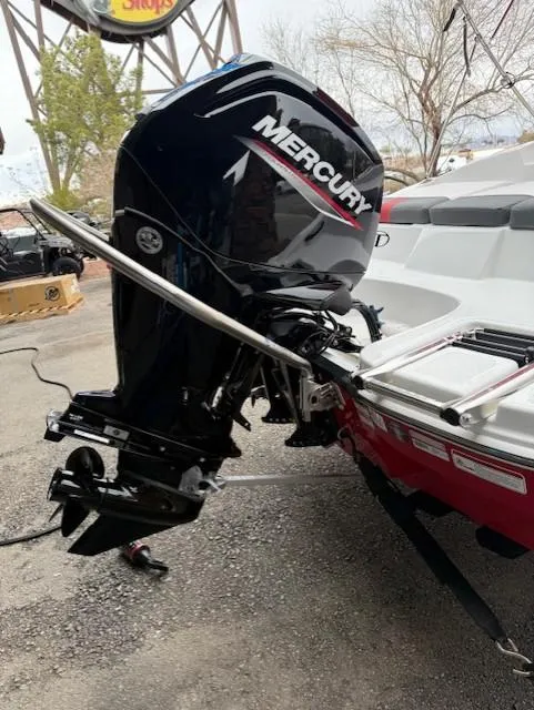 Slide: The Image of 2025 Tahoe T16 boat with Mercury outboard motor, parked outdoors. - 5