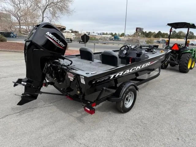 Slide: The Image of 2025 Tracker Pro 170 boat with Mercury engine, parked outdoors on a trailer. - 2