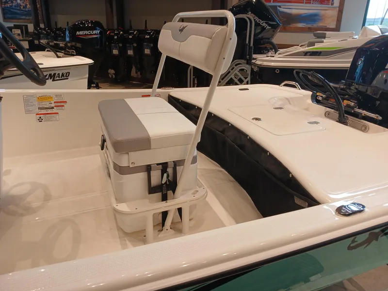 Slide: The Image of 2025 Mako Pro Skiff 17 CC boat interior with seating and storage. - 4