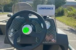 Slide: The Image of 2025 Tracker Bass Tracker Classic Limited dashboard with Lowrance fish finder. - 3