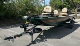 Slide: The Image of 2025 Tracker Bass Tracker Classic Limited boat on trailer in parking lot. - 4