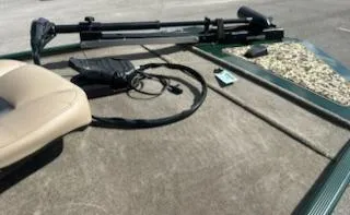 Slide: The Image of 2025 Tracker Bass Tracker Classic Limited boat deck with fishing equipment. - 5