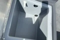 Slide: The Image of 2025 Tracker Bass Tracker Classic Limited storage compartment, open and empty. - 9