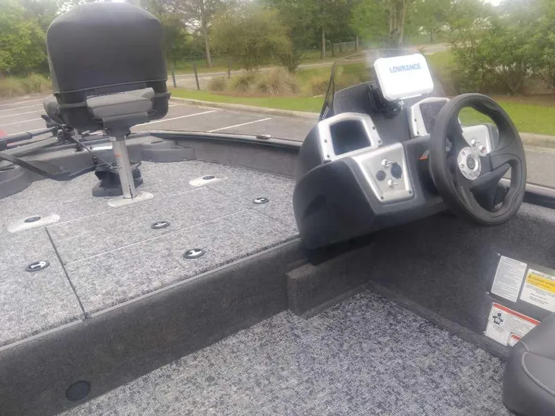 Slide: The Image of 2025 Tracker Pro Team 175 boat interior with steering wheel and seating. - 10