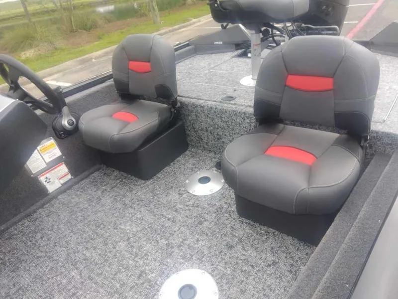 Slide: The Image of 2025 Tracker Pro Team 175 boat interior with gray and red cushioned seats. - 11