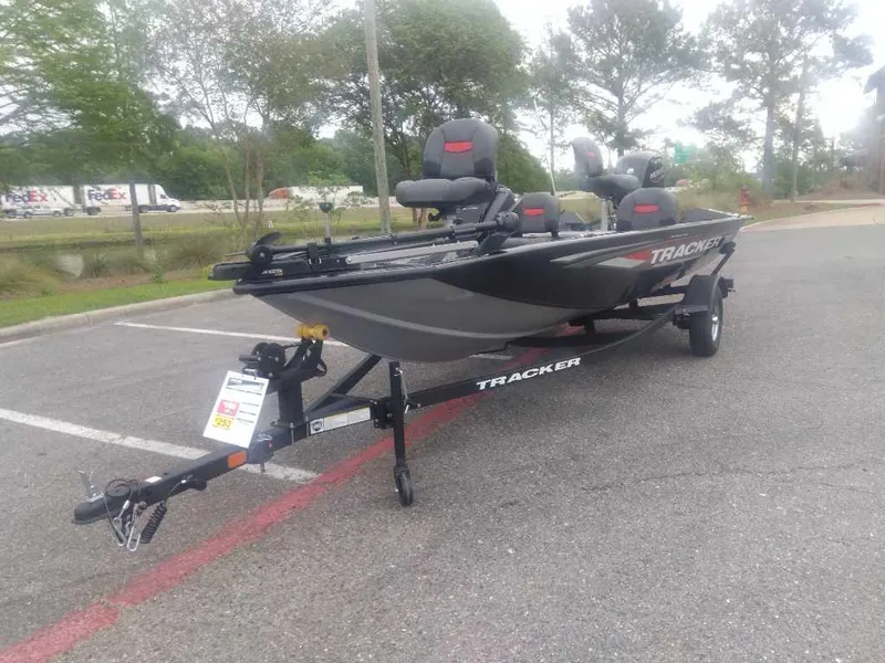 Slide: The Image of 2025 Tracker Pro Team 175 boat on trailer in parking lot. - 14