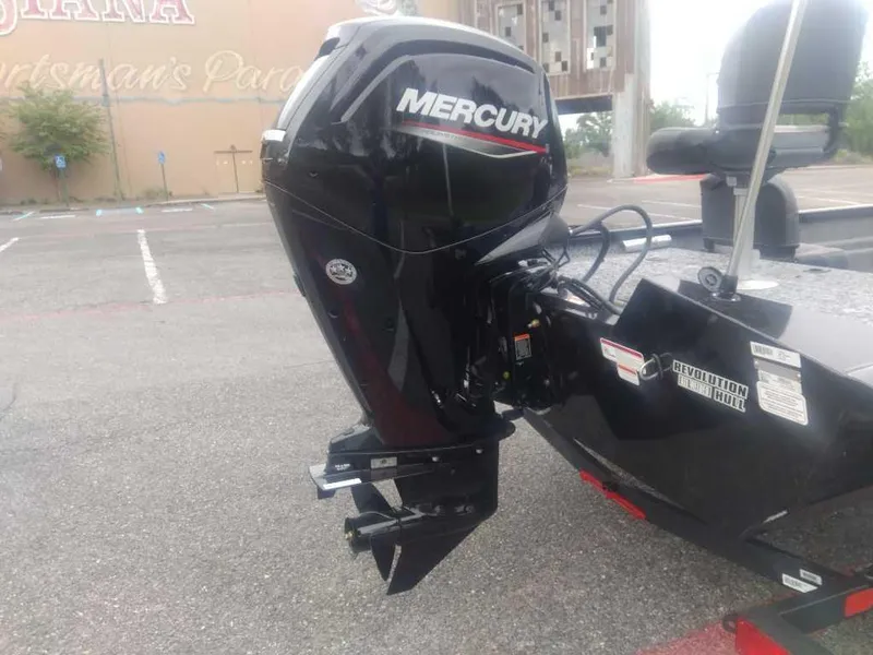 Slide: The Image of 2025 Tracker Pro Team 175 boat with Mercury outboard motor in parking lot. - 4