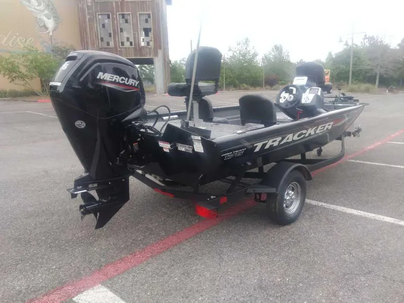 Slide: The Image of 2025 Tracker Pro Team 175 boat with Mercury engine on trailer in parking lot. - 5