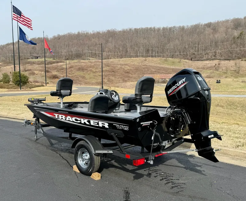 Slide: The Image of 2025 Tracker Pro Team 175 Crappie Edition boat on trailer, parked outdoors. - 4