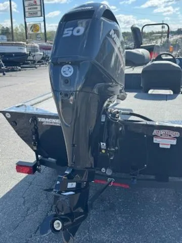 Slide: The Image of 2025 Tracker Bass Tracker Classic XL with Mercury 50 HP engine, parked outdoors. - 3