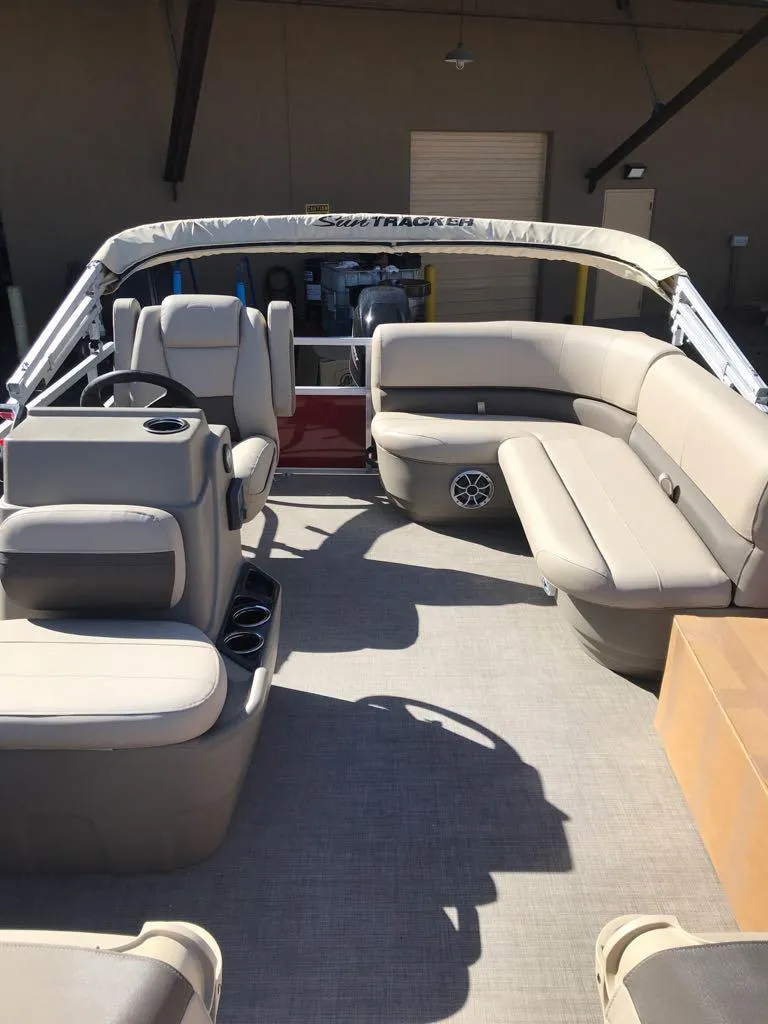 Slide: The Image of 2025 Sun Tracker Bass Buggy 16 XL Select pontoon boat with spacious seating and modern design. - 7