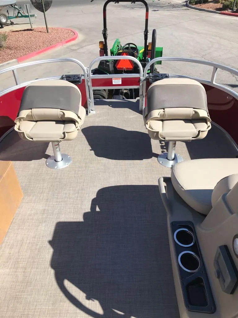Slide: The Image of 2025 Sun Tracker Bass Buggy 16 XL Select interior with seating and cup holders. - 8