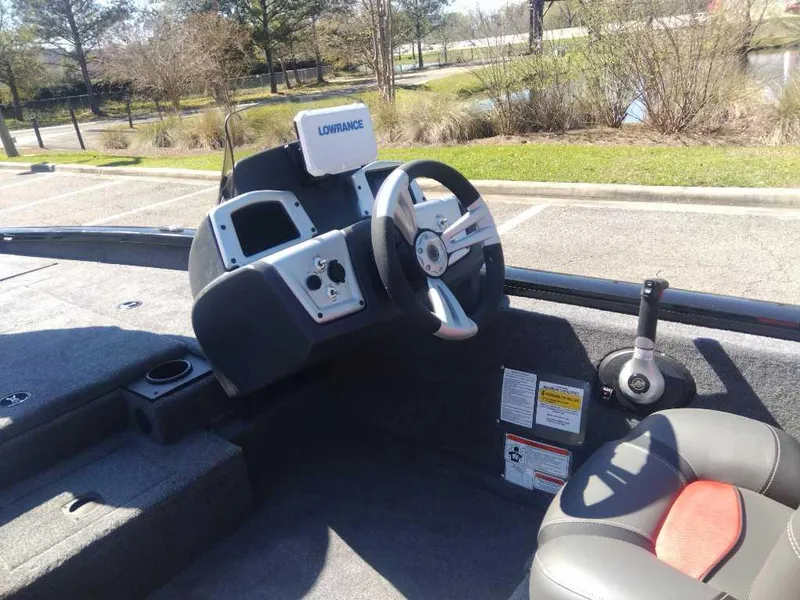 Slide: The Image of 2025 Tracker Pro Team 175 boat interior with steering wheel and control panel. - 11