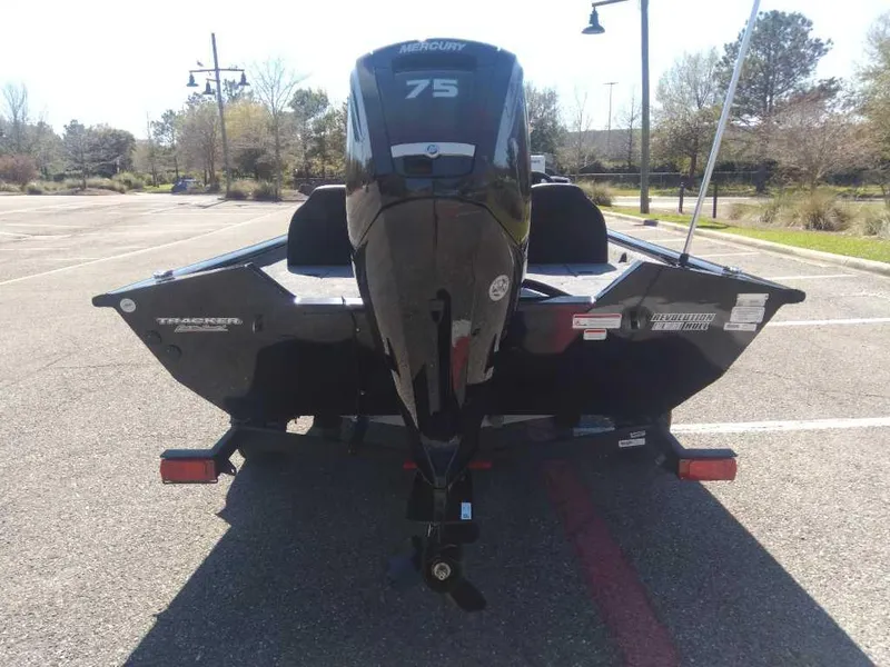 Slide: The Image of 2025 Tracker Pro Team 175 boat with Mercury 75 engine in parking lot. - 3