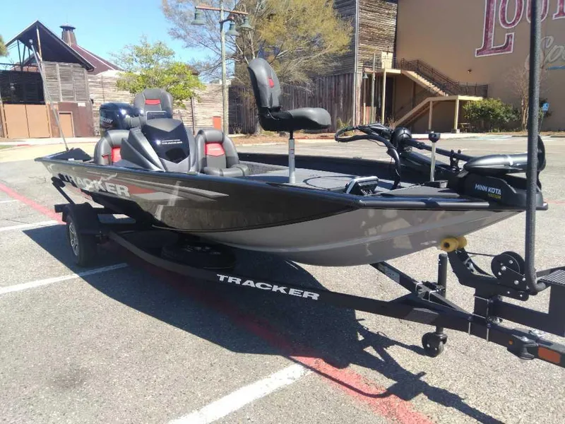 Slide: The Image of 2025 Tracker Pro Team 175 boat on trailer in parking lot. - 7