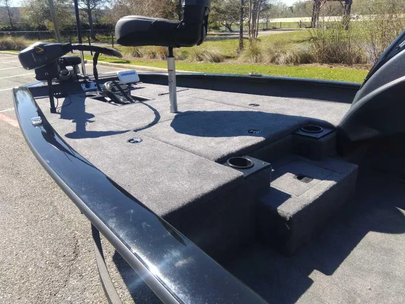 Slide: The Image of 2025 Tracker Pro Team 175 boat deck with seating and fishing equipment. - 9