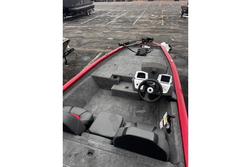 Slide: The Image of 2025 Tracker Pro Team 175 boat interior with steering wheel and control panels. - 59