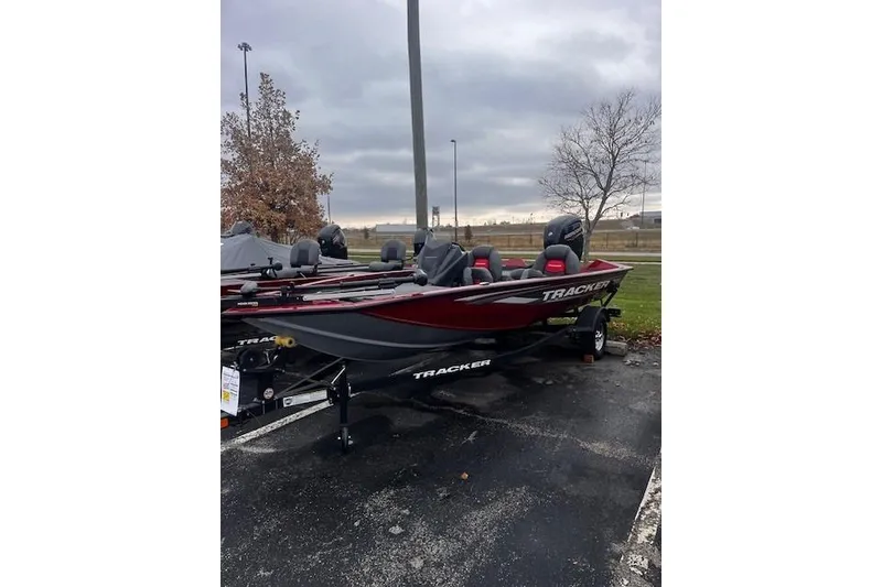 Slide: The Image of 2025 Tracker Pro Team 175 boat parked outdoors on a cloudy day. - 63