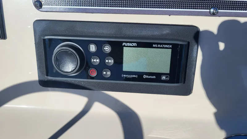 Slide: The Image of Fusion MS-RA70NSX stereo system on 2024 Boston Whaler 210 Montauk boat dashboard. - 10