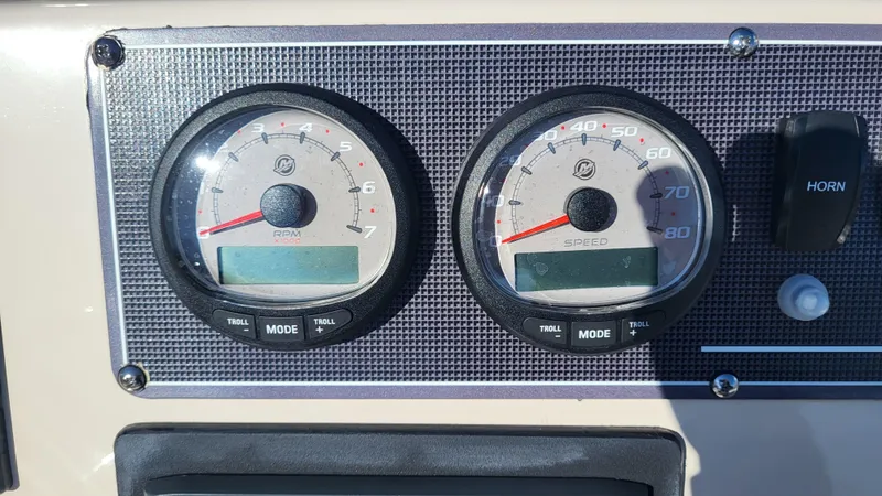 Slide: The Image of Dashboard of 2024 Boston Whaler 210 Montauk with speed and RPM gauges. - 11