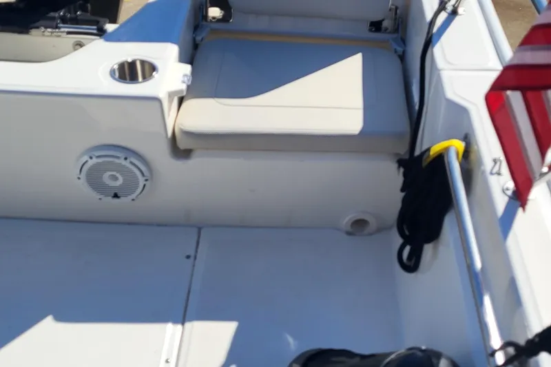 Slide: The Image of 2024 Boston Whaler 210 Montauk boat interior with seating and speaker. - 17